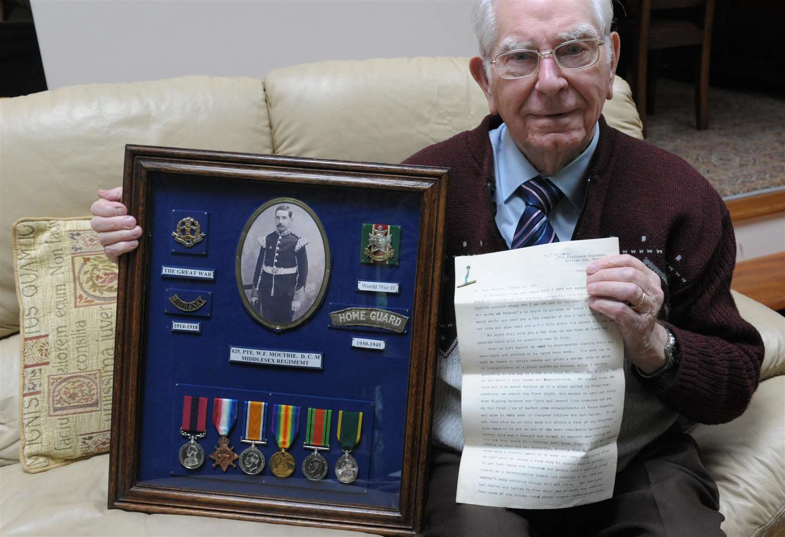 Douglas Moultrie with pictures and letters/medals from his father