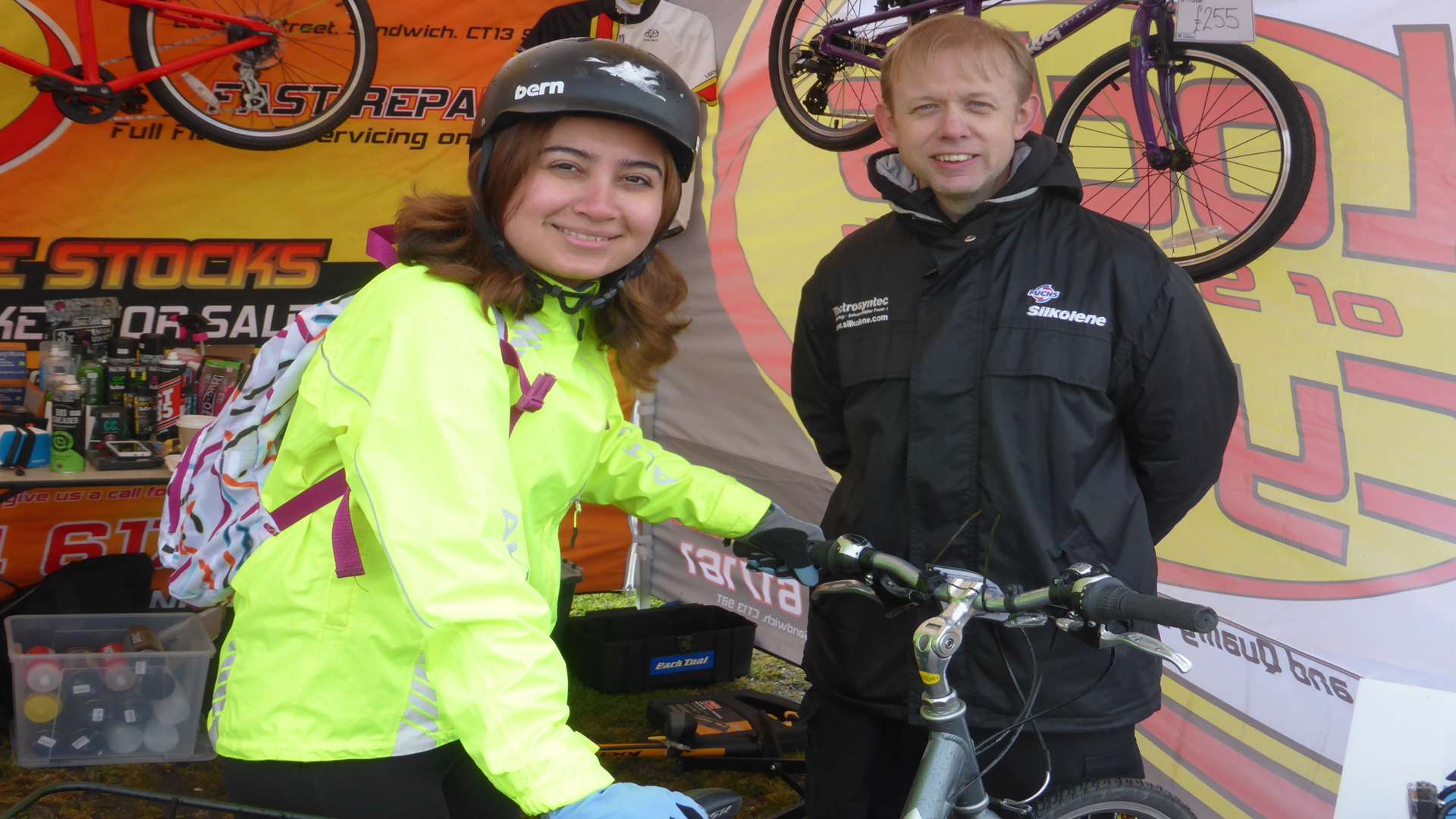 Martin Hayes of Locks of Sandwich Cycles provides maintenance to Sahar Naaseri's cycle at the KM Big Bike Ride. The KM Big Bike Ride attracted 370 riders taking part in either the 50km or 100km routes. Riders could take part for fun or for charity. £17k was raised for good causes.