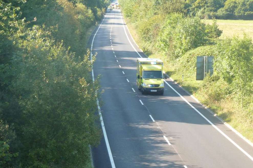 An ambulance leaves the scene of the crash
