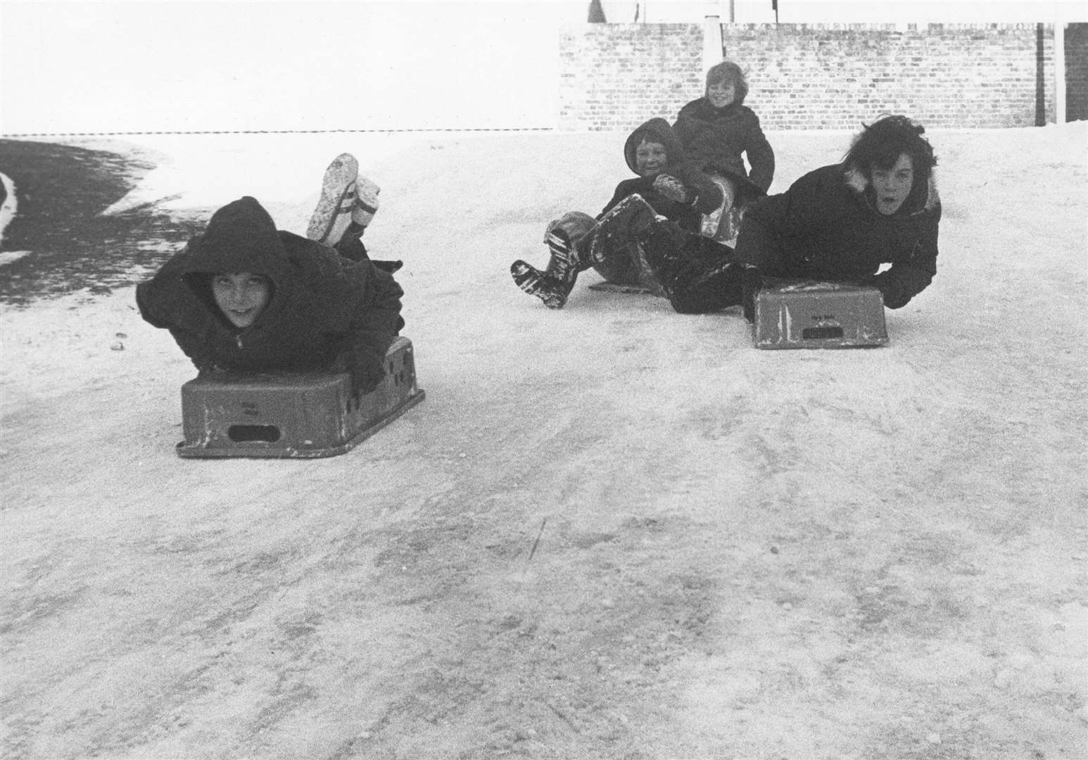 Children enjoying sledging during the cold weather in '79