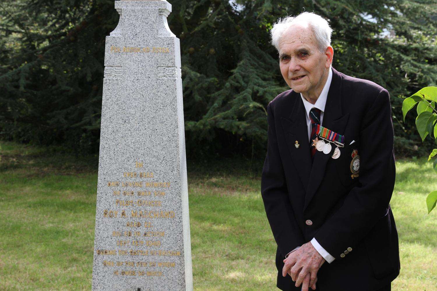 Ex-Squadron Leader Leslie Armstrong beside the memorial at Nouds Farm.