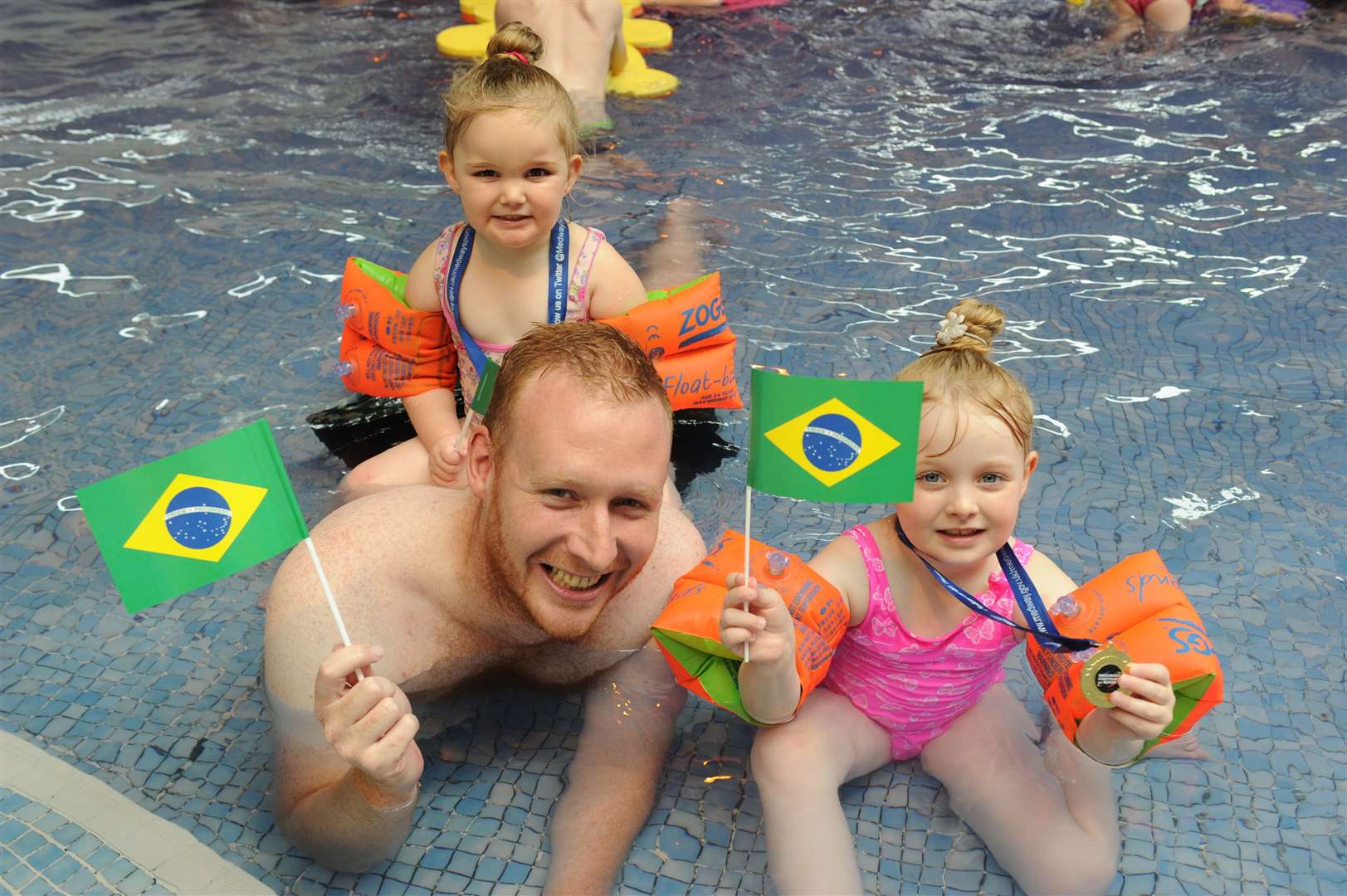 Rio Olympic themed family fun day. Nick Morris with Ellie and Katie aged 5 and 3