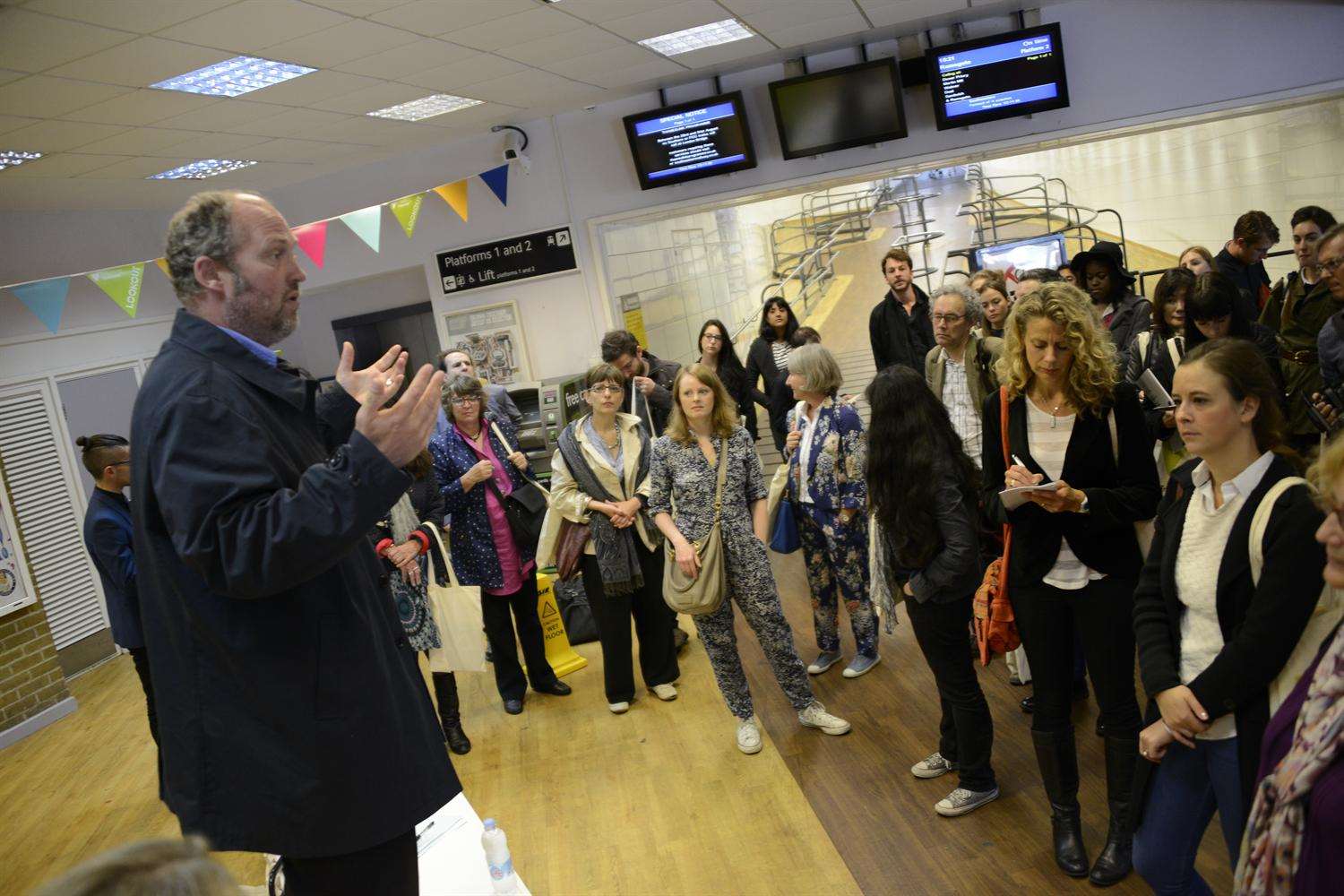 Creative Foundation chief executive Alastair Upton greets visitors at Folkestone Central station