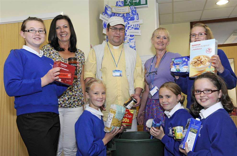Year 6 pupils at The Downs with staff and Deal Area Emergency Foodbank volunteers