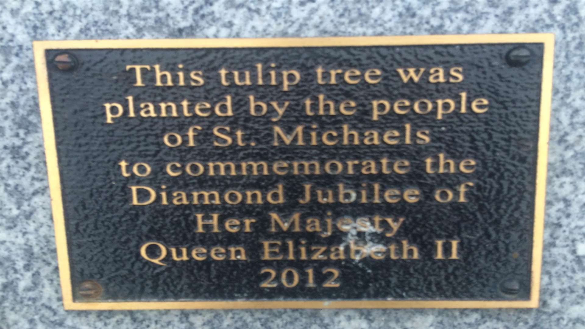 The plaque on the tree planted by the late Sir Donald Sinden