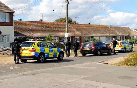 Armed police surround a house in Dunes Road, Greatstone. Picture: Peter Faulkner
