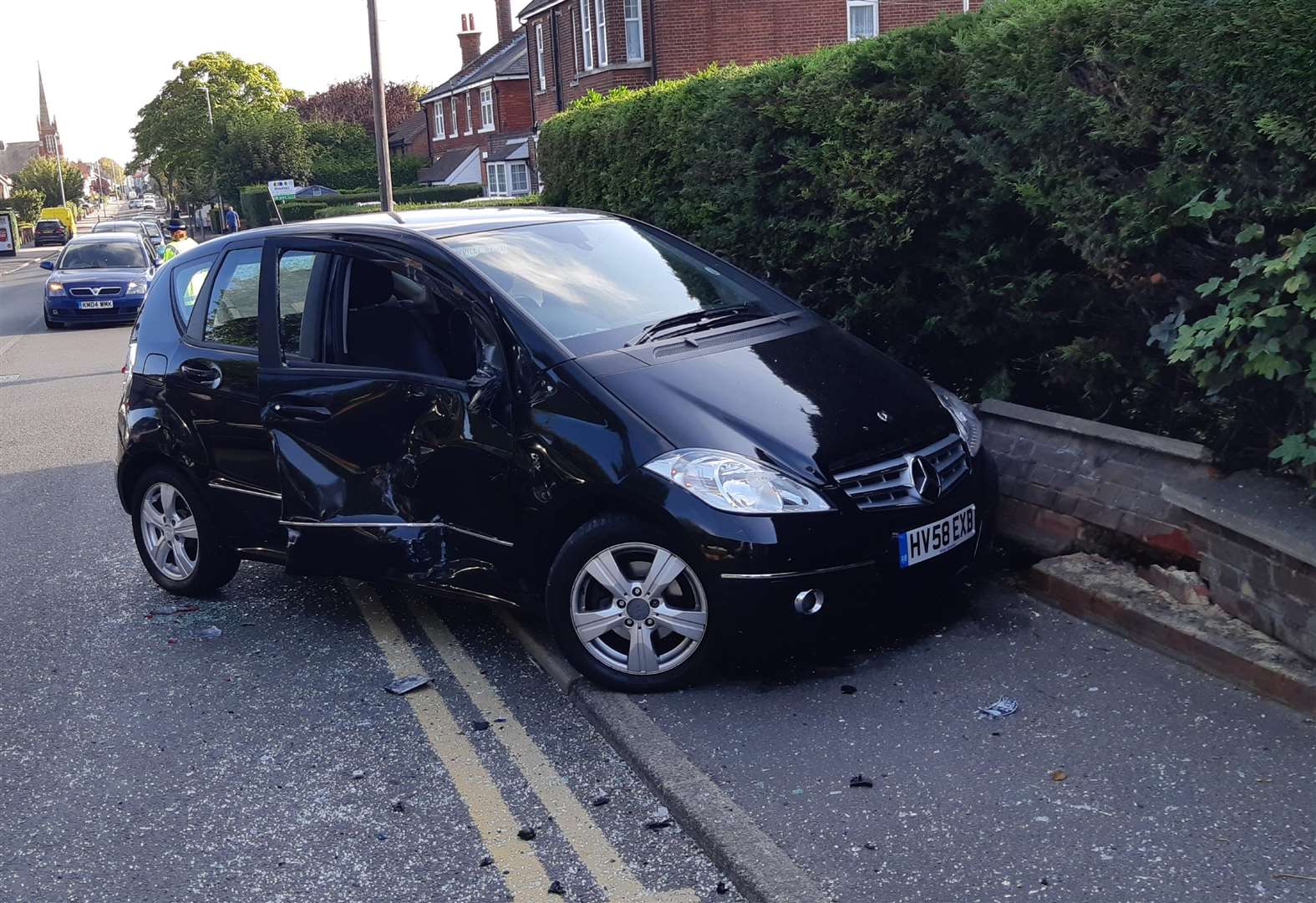 The black Mercedes collided with a bus on Dover Road