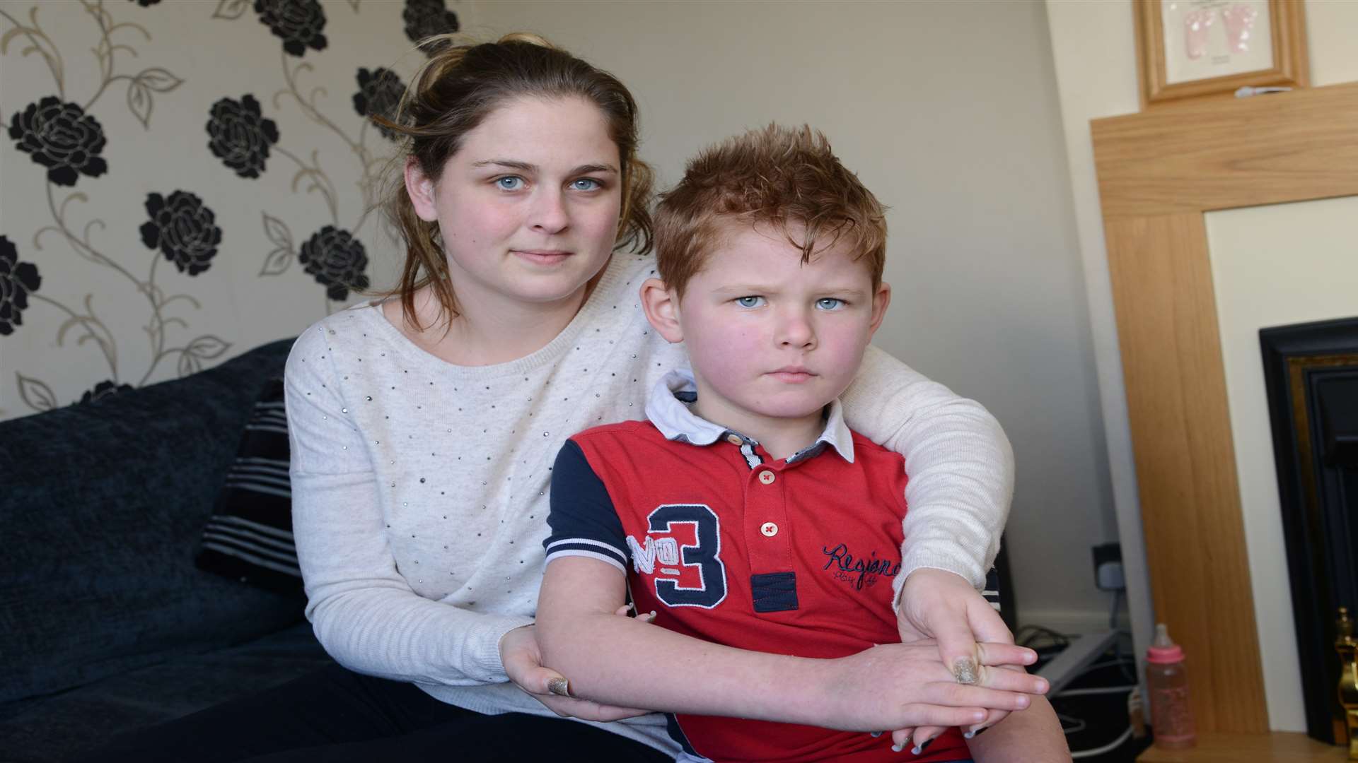 Cheryl Pemble with her son George, eight, who is recovering from a mystery rash