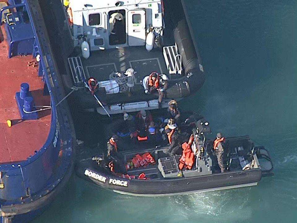 A boat carrying migrants being towed into Dover. Picture: Sky News.