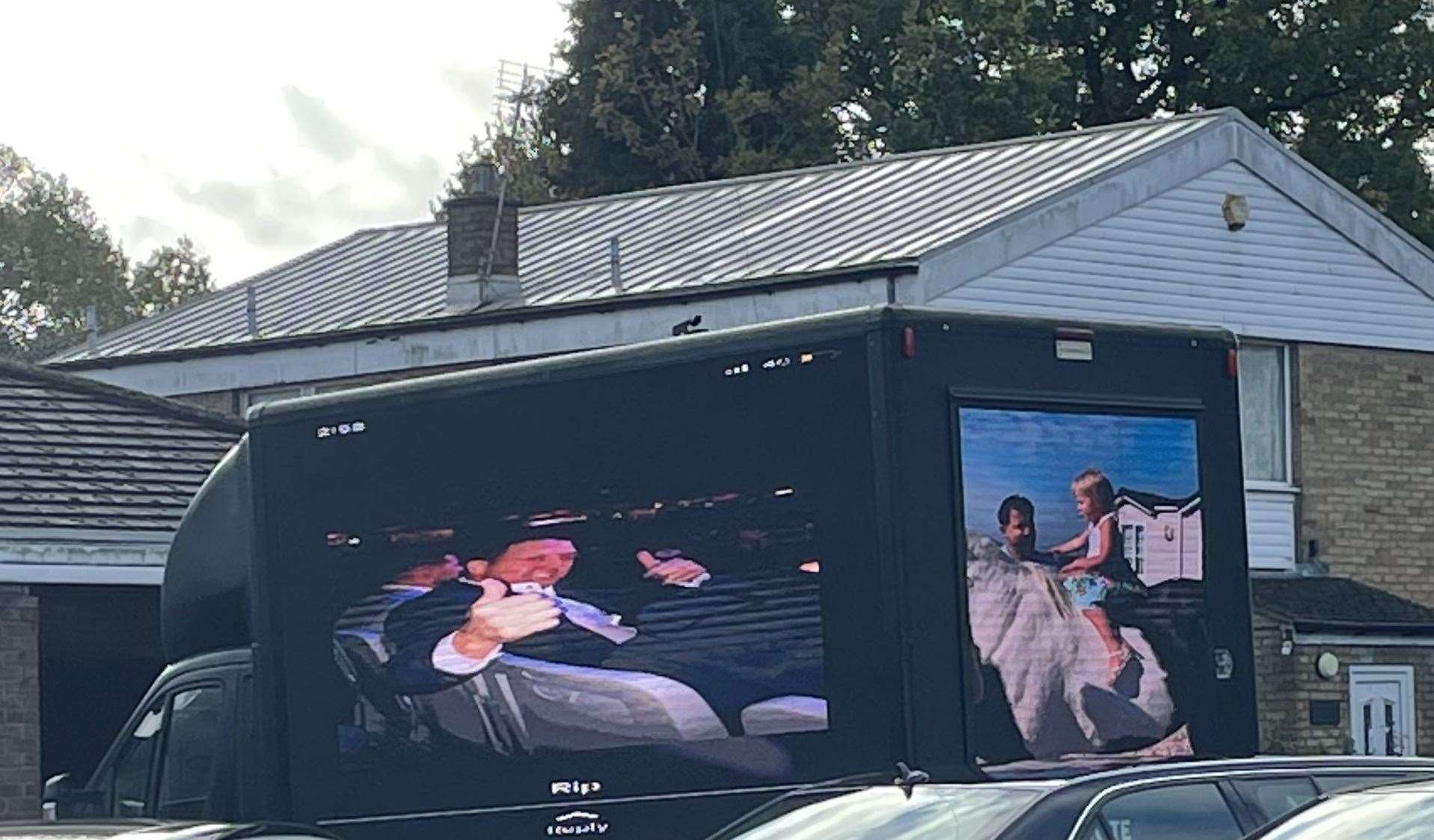 Photos of father and son Johnny Cash and Johnboy have been projected on to a van at their funerals in Maidstone