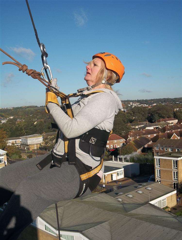 Gillian Smissen of Dover for Harmony Therapy Trust takes part in the Canterbury abseil