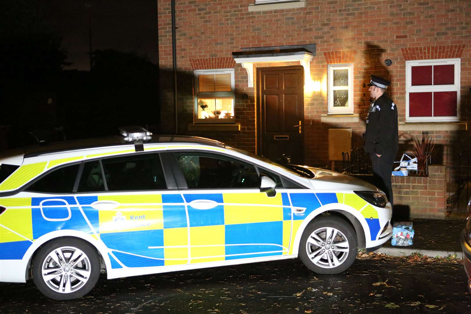 Police outside the terraced property. Picture: UKNIP