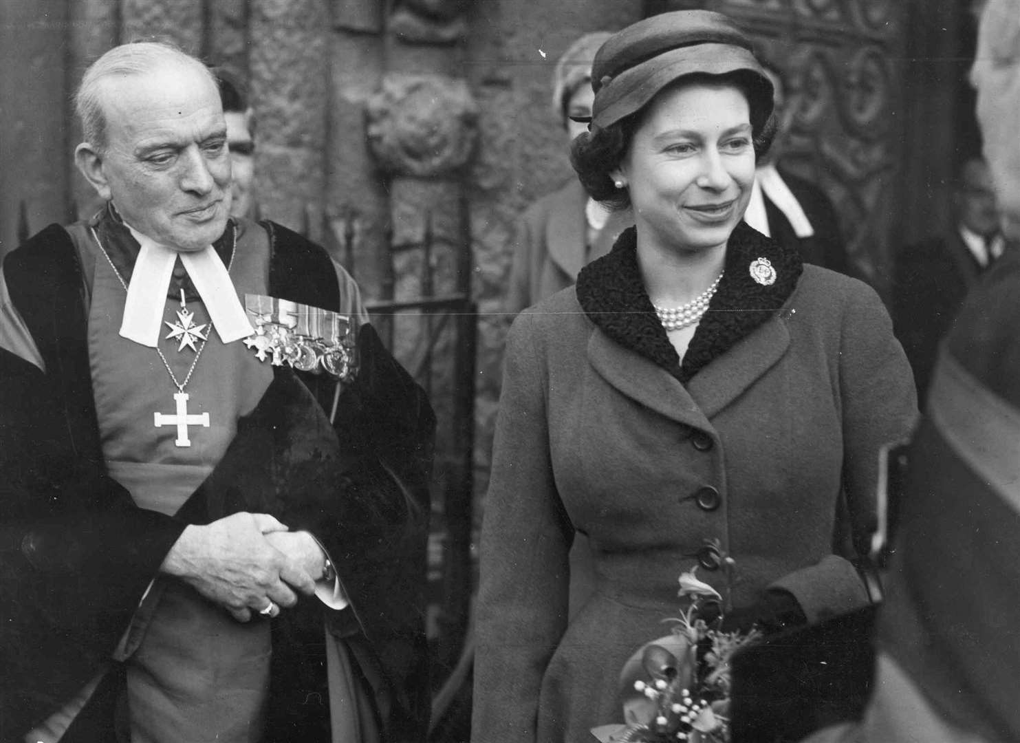 During a visit to Rochester the Queen made a brief visit to the Cathedral. She is pictured with the Bishop, Dr C.M. Chavasse. Picture: Images of Medway