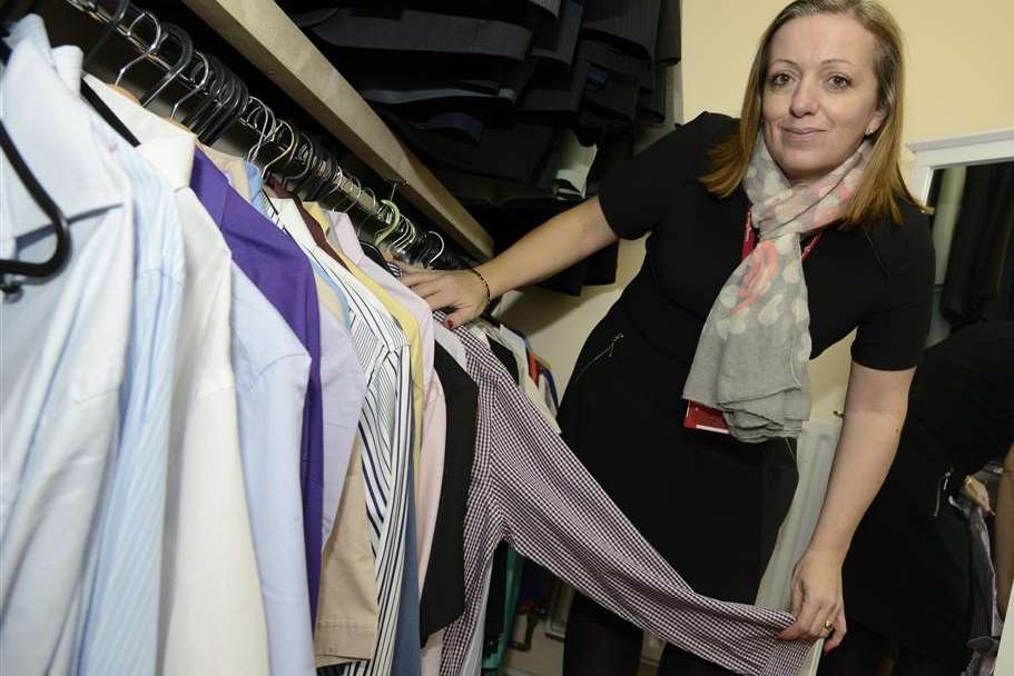 Juliet Shand, from Golding Homes, with clothes bought to help tenants make a better impression at job interviews