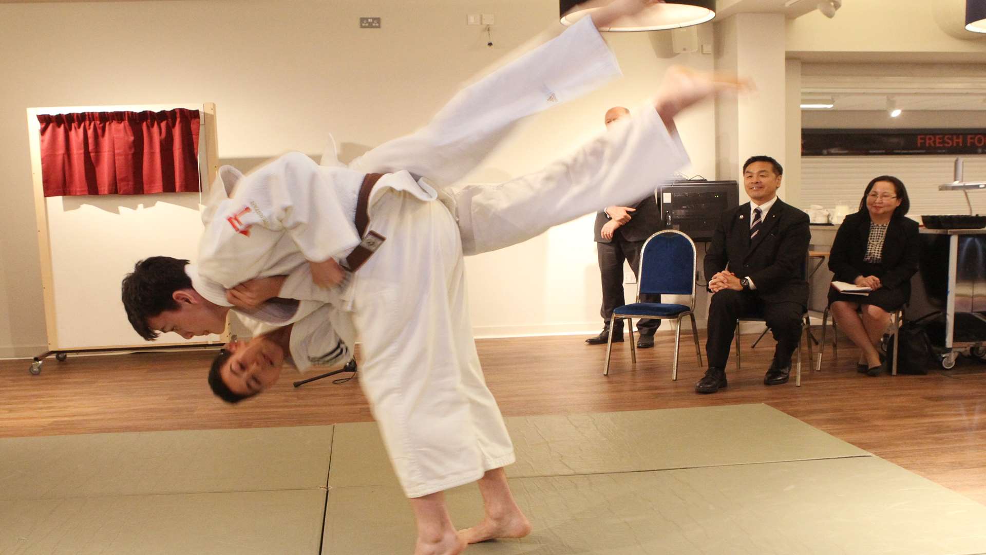 Patrick Sykes, 16, throws Elyas Agounizera, 13, during a judo demonstration.