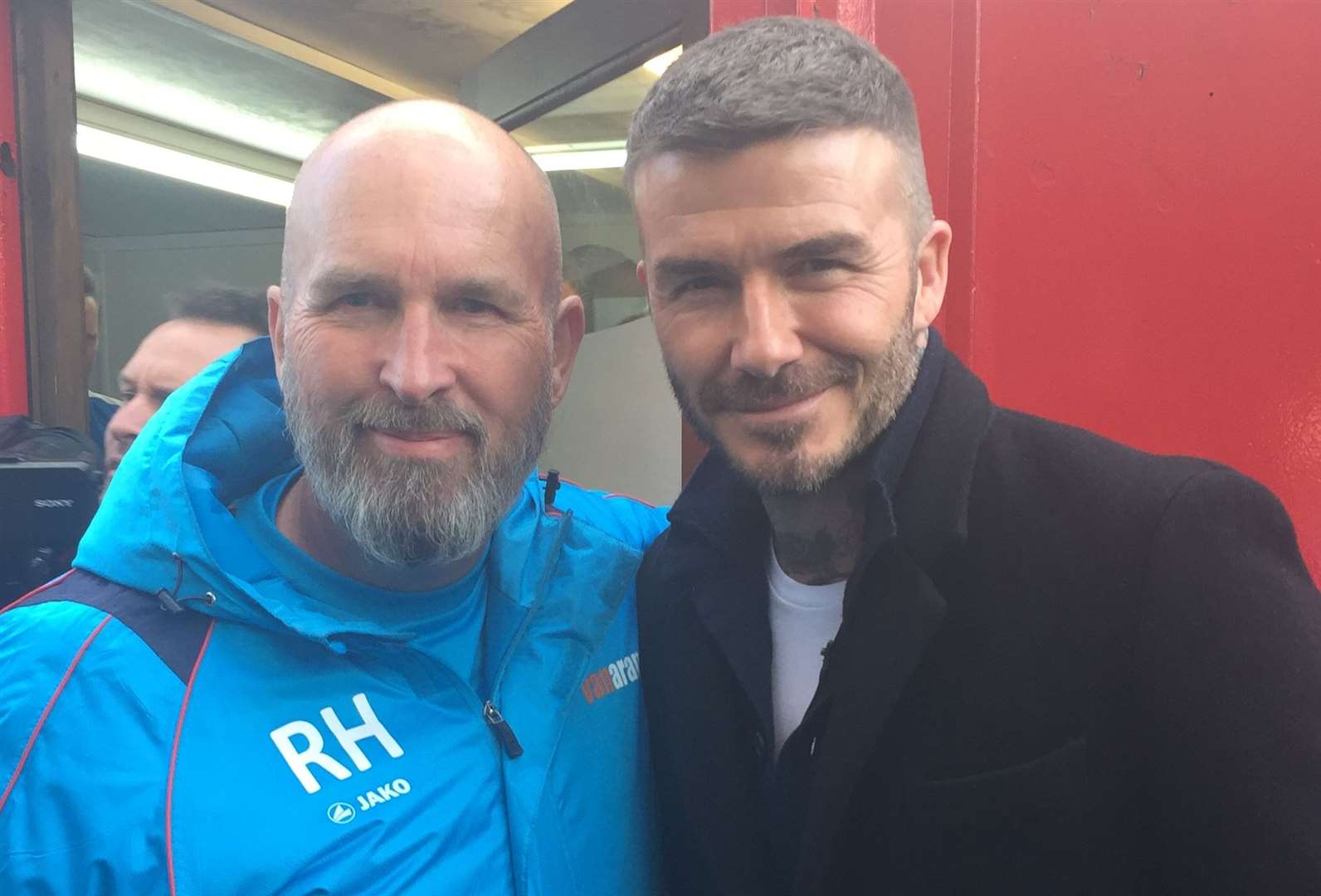 Dover kitman Richard Harvey pictured with former Manchester United and England legend David Beckham at Salford last season