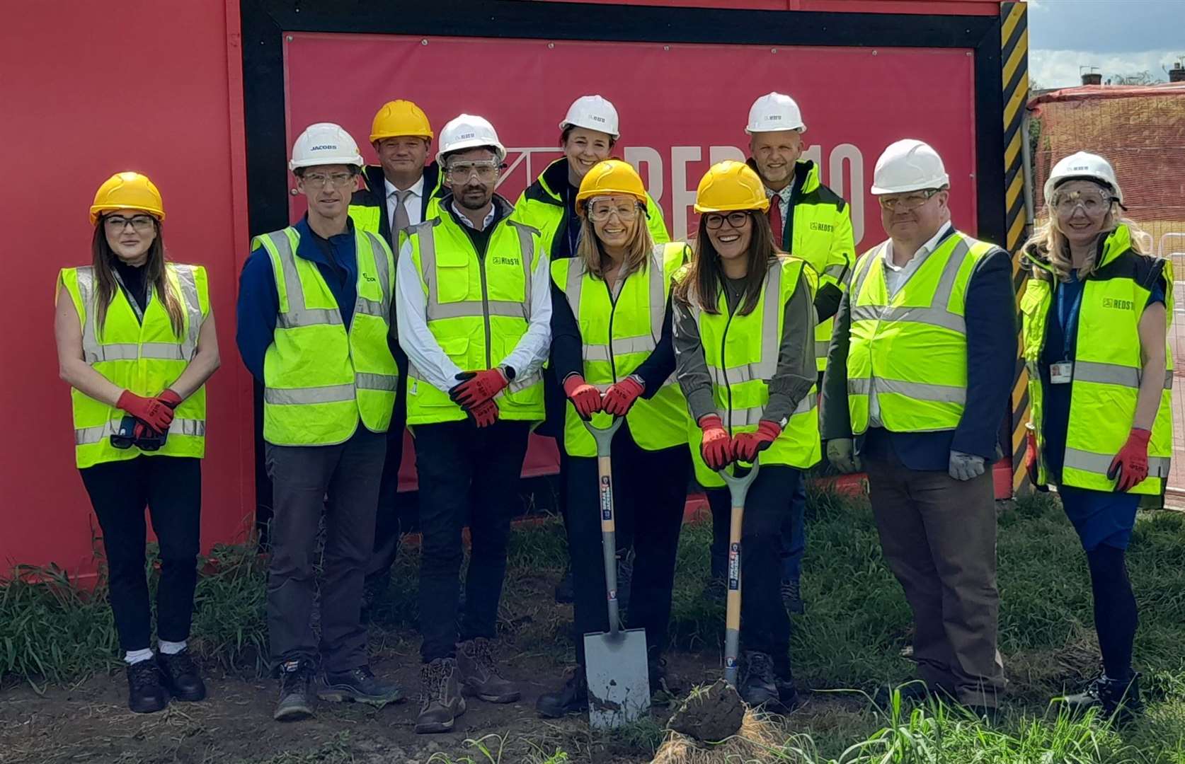 Sabden’s chief executive officer Jo Foulkes (front centre left) and head of operations and development Anna Morse start the work watched by representatives of KCC, the Department for Education and construction company Reds10.