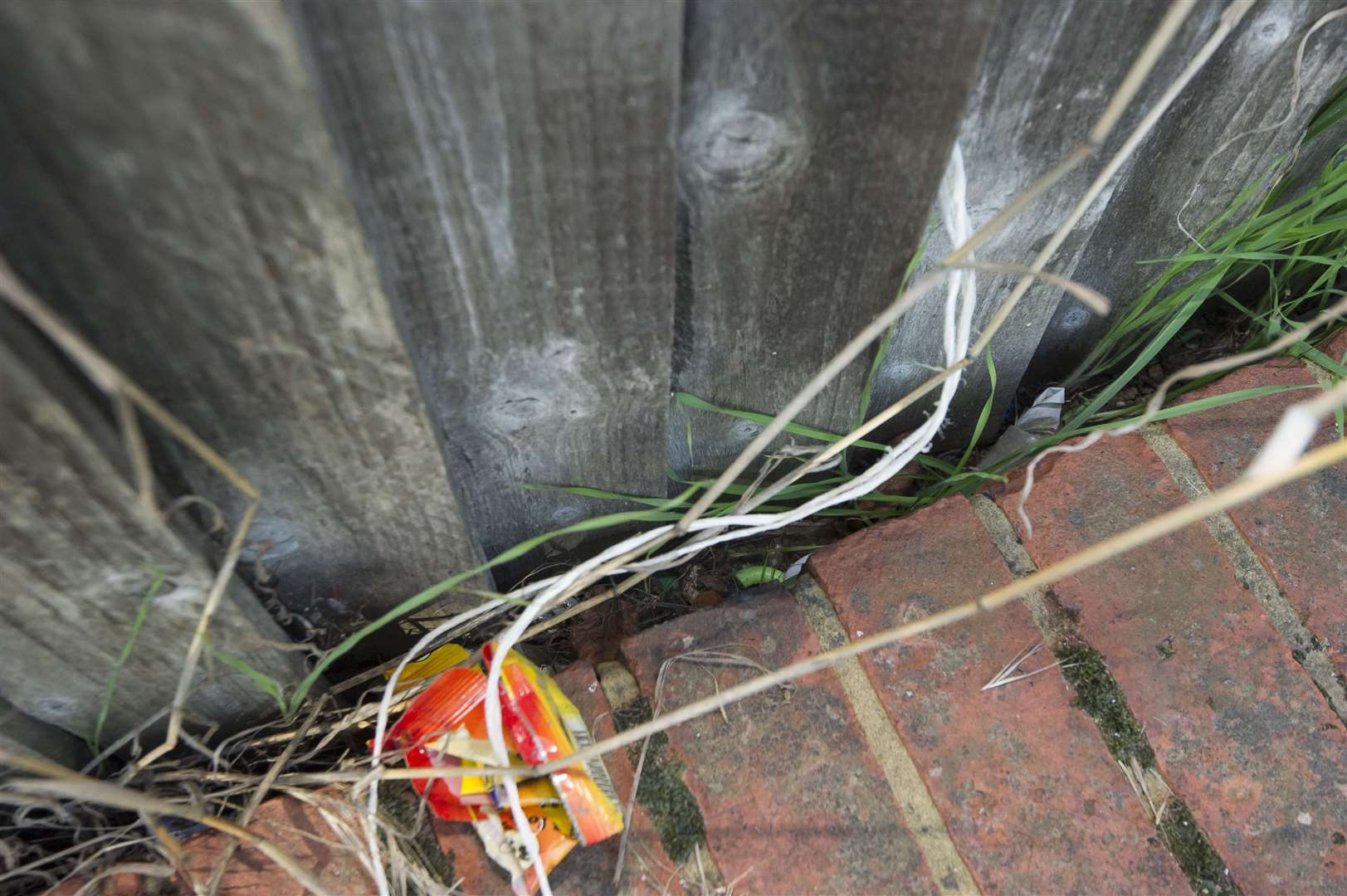 Needles are often found between the wall and fencing here at the junction of Littlebrook Manorway and Henderson Drive, Temple Hill