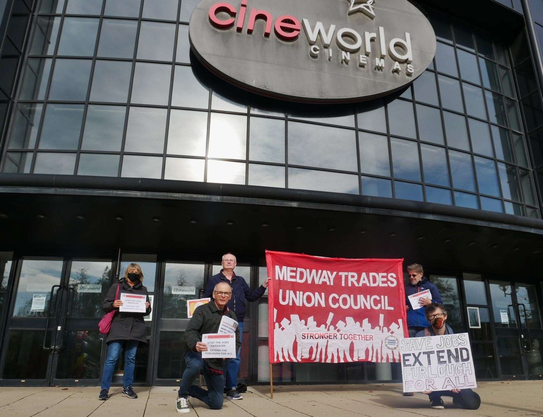 The small group gathers for a socially-distanced flash demo. Picture: Medway TUC