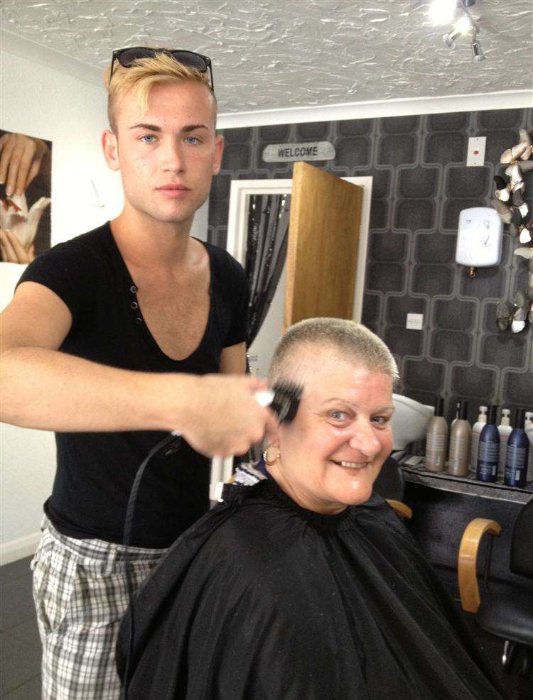 Dhareigne Pearce has her head shaved for charity by hairdresser Sonny Hanigen