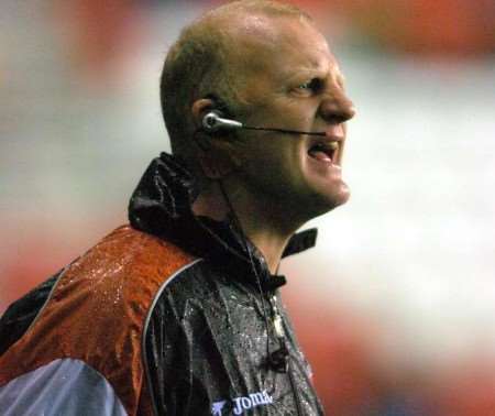 FRUSTRATION: Iain Dowie in the rain as Charlton went 3-1 down at Wigan on Saturday. Picture: MATT WALKER