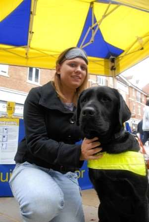 Sam Reynolds, 23, from Canterbury, after her blindfolded walk with guide dog Reggie. Picture: Barry Duffield