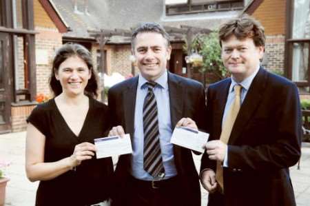 Kent Messenger senior editor Bob Bounds presents cheques to Kate Bosley chief executive of the Heart of Kent Hospice and David Terry trustee of the Kent and Medway Walking Bus Scheme.