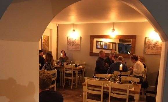 The dining room, through an archway on the left hand side of the bar, was busy all evening with all the tables booked