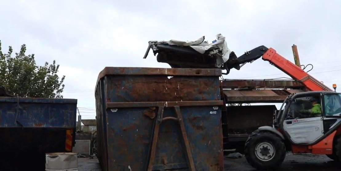 Gone into the skip - a van impounded from Sheerness is crushed at Bobbing Car Breakers as part of Swale council's fight against fly-tipping. Picture: Swale Council
