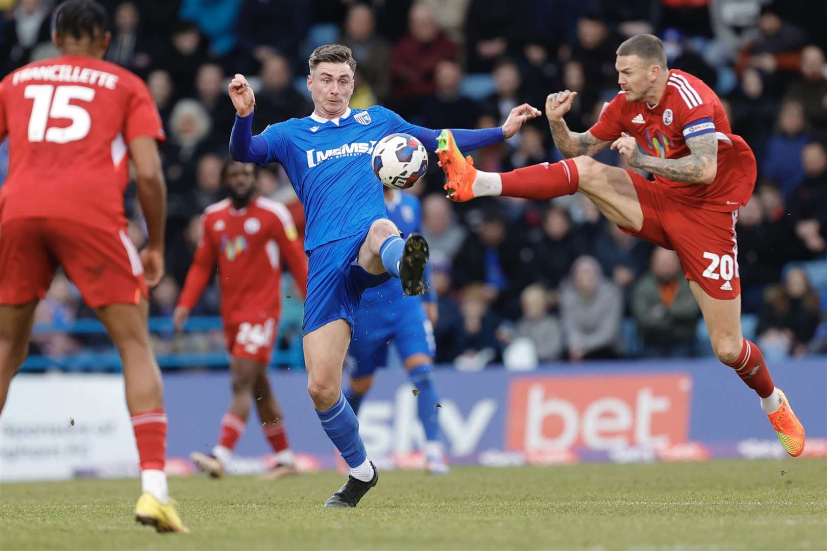 Oli Hawkins and Ben Gladwin challenge for the ball as Gillingham face Crawley Town at Priestfield