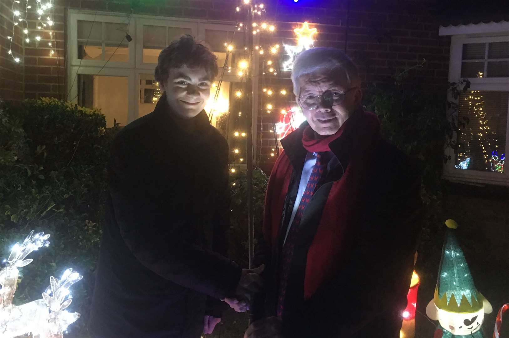 Callum Dunne and charity chairman Des Long at the Christmas light switch-on. Picture: Des Long