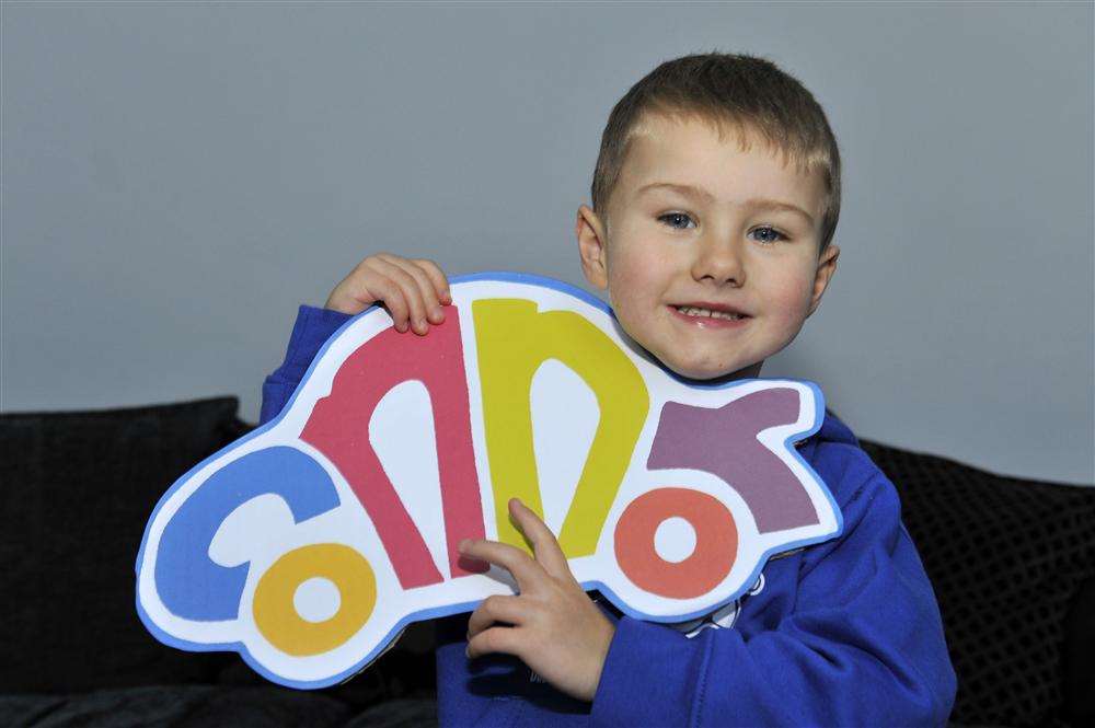 Connor Olsen, four, who has Duchenne muscular dystrophy, from Westgate, with his "colour" car logo as family and friends urge workers to support a Colour for Connor day to raise funds for treatment.