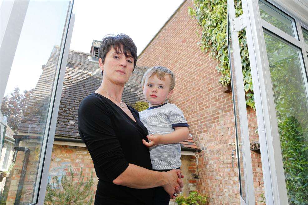 Nicola Bowden with two-year-old Jude in her garden.