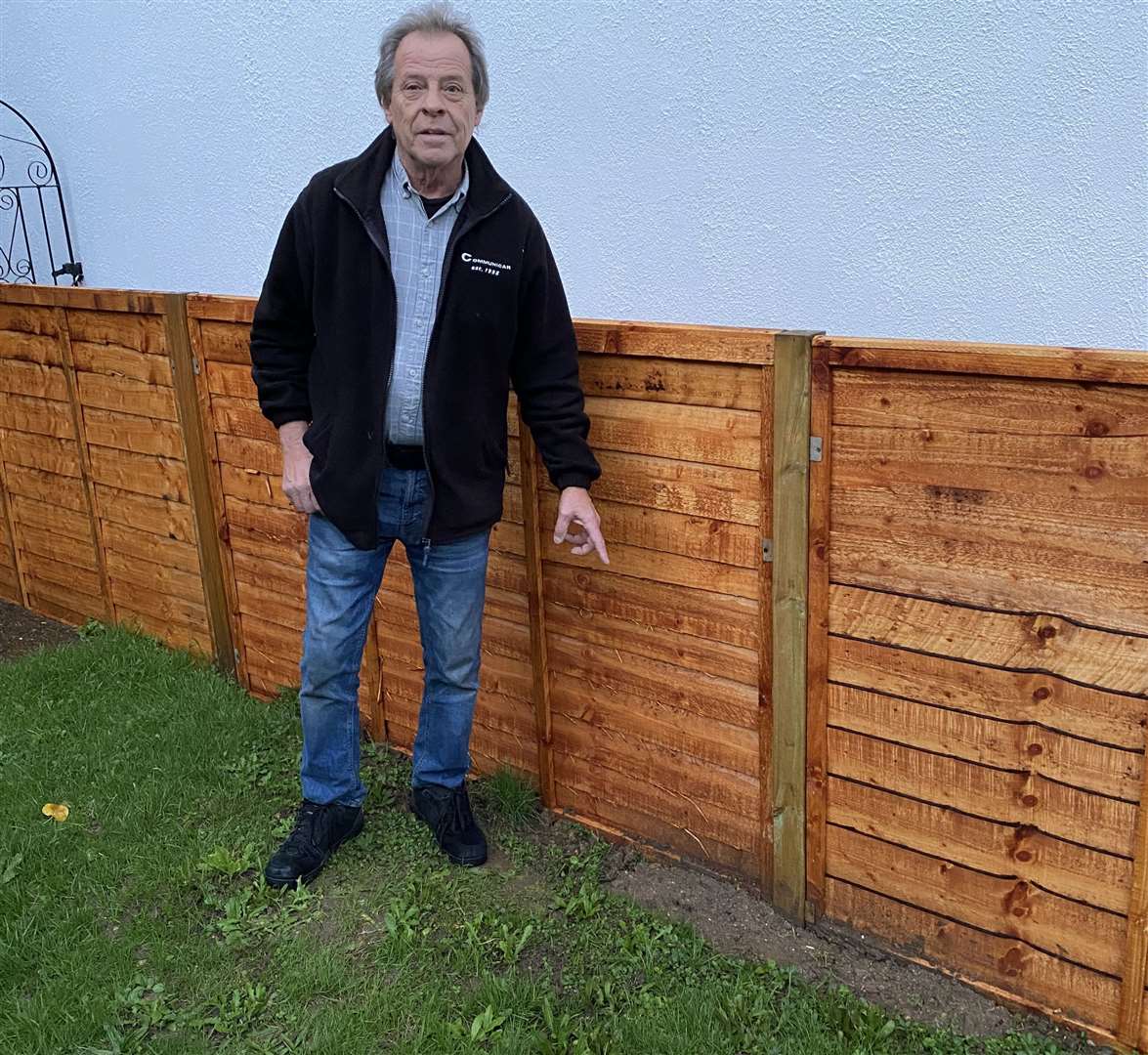 Phil Lewis found a warning sign when fitting a fence in his partner's garden. Picture: Phil Lewis