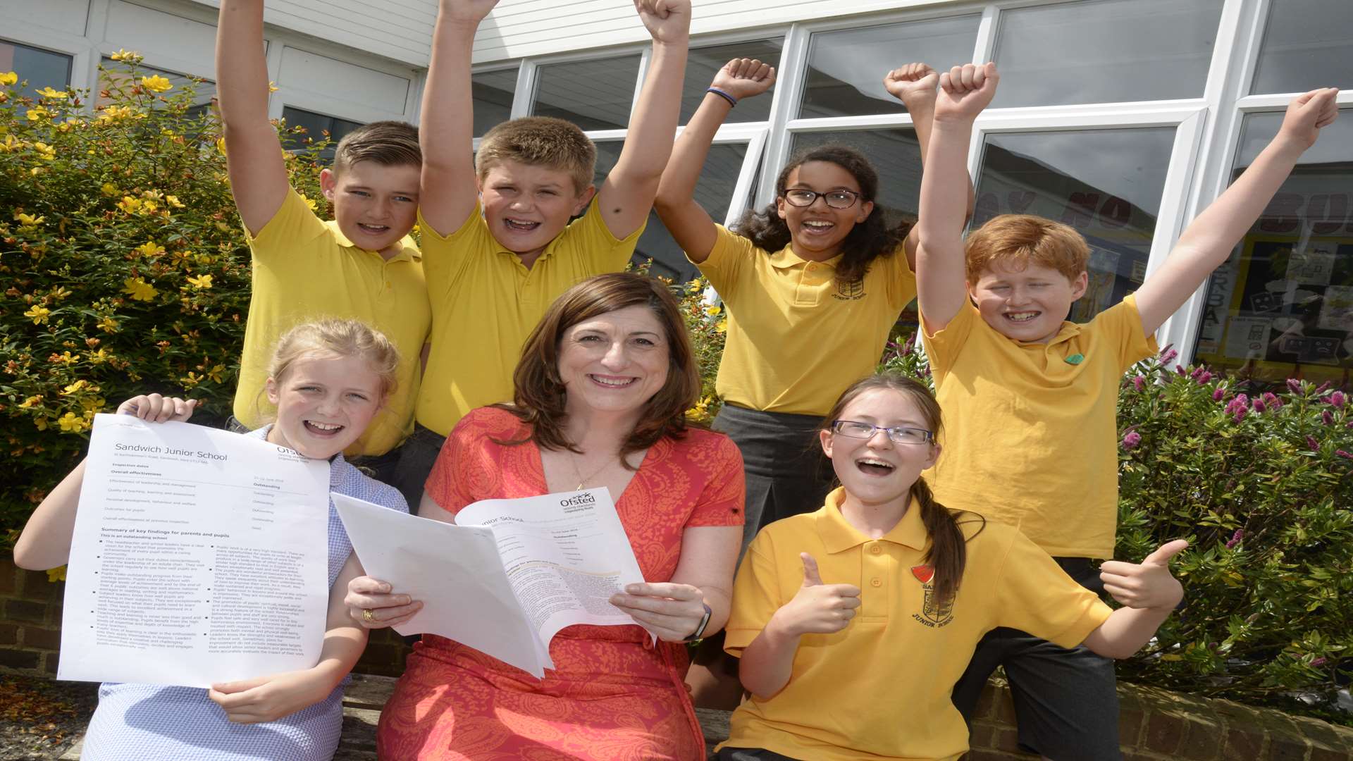 Head teacher Sheilagh Roberts celebrates with some Year 6 pupils