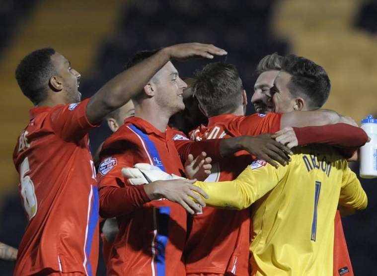 Gillingham celebrate their shoot-out win over Colchester Picture: Barry Goodwin
