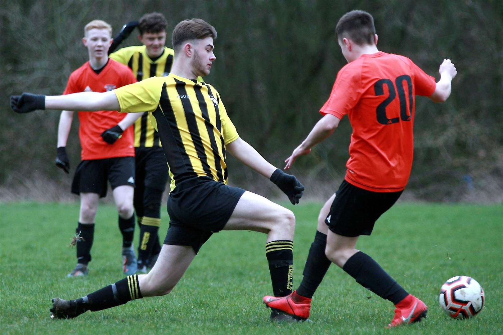 Rainham Eagles under-18s (stripes) put their foot in against Lordswood Youth Tigers under-18s. Picture: Phil Lee FM29961651