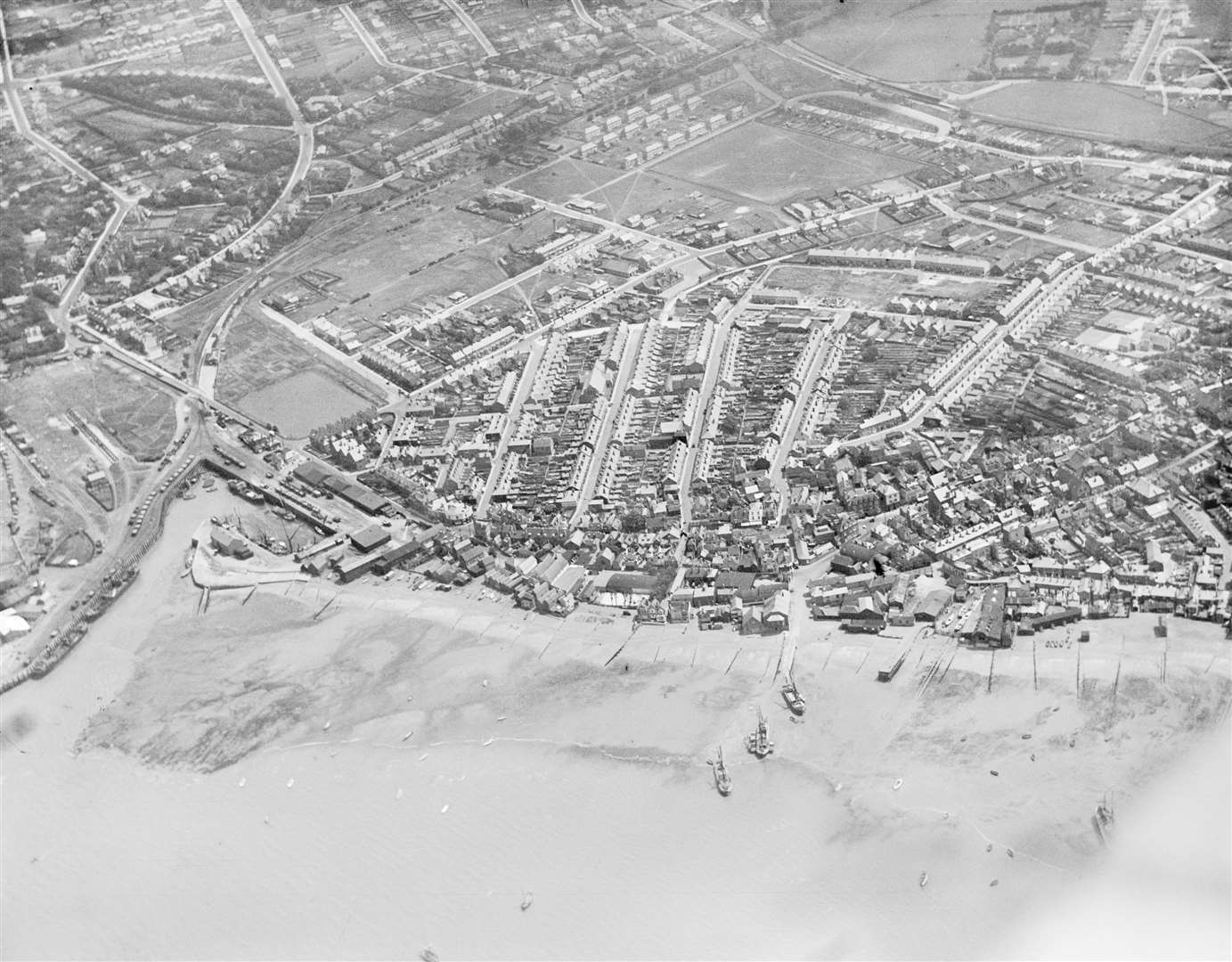 Whitstable from the skies in 1927 - with the harbour seen bottom left. Picture: Historic England