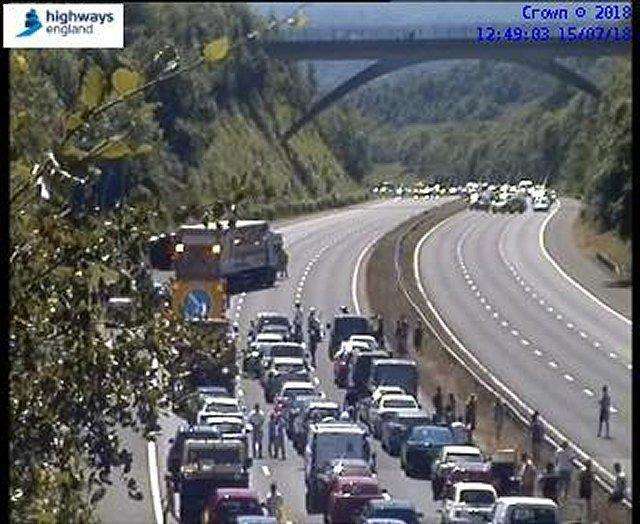 A Highways England motorway camera shows standstill traffic and people out of their cars on the M25. (3066604)