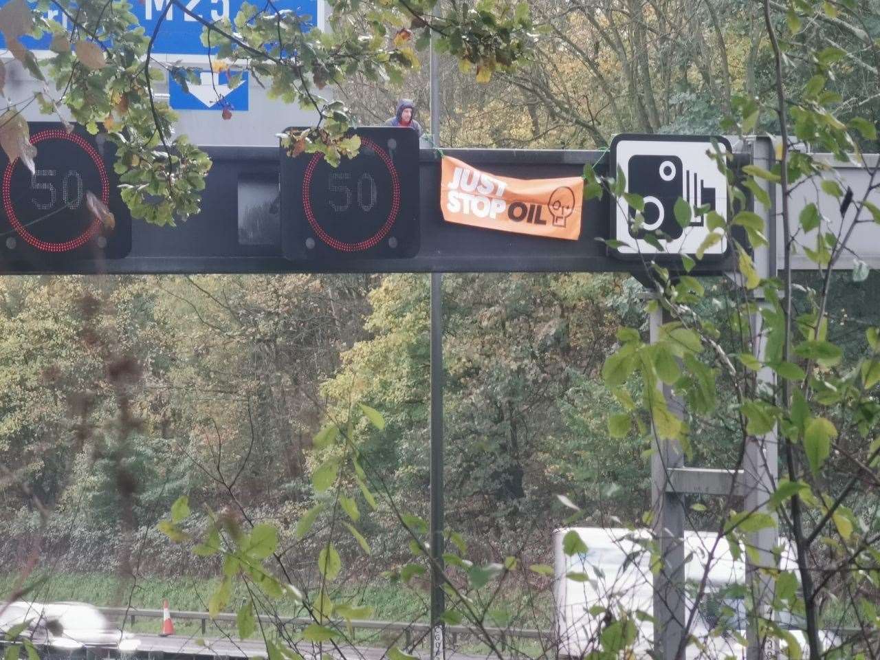 Protesters have climbed onto several overhead gantries along the M25. Picture: Just Stop Oil