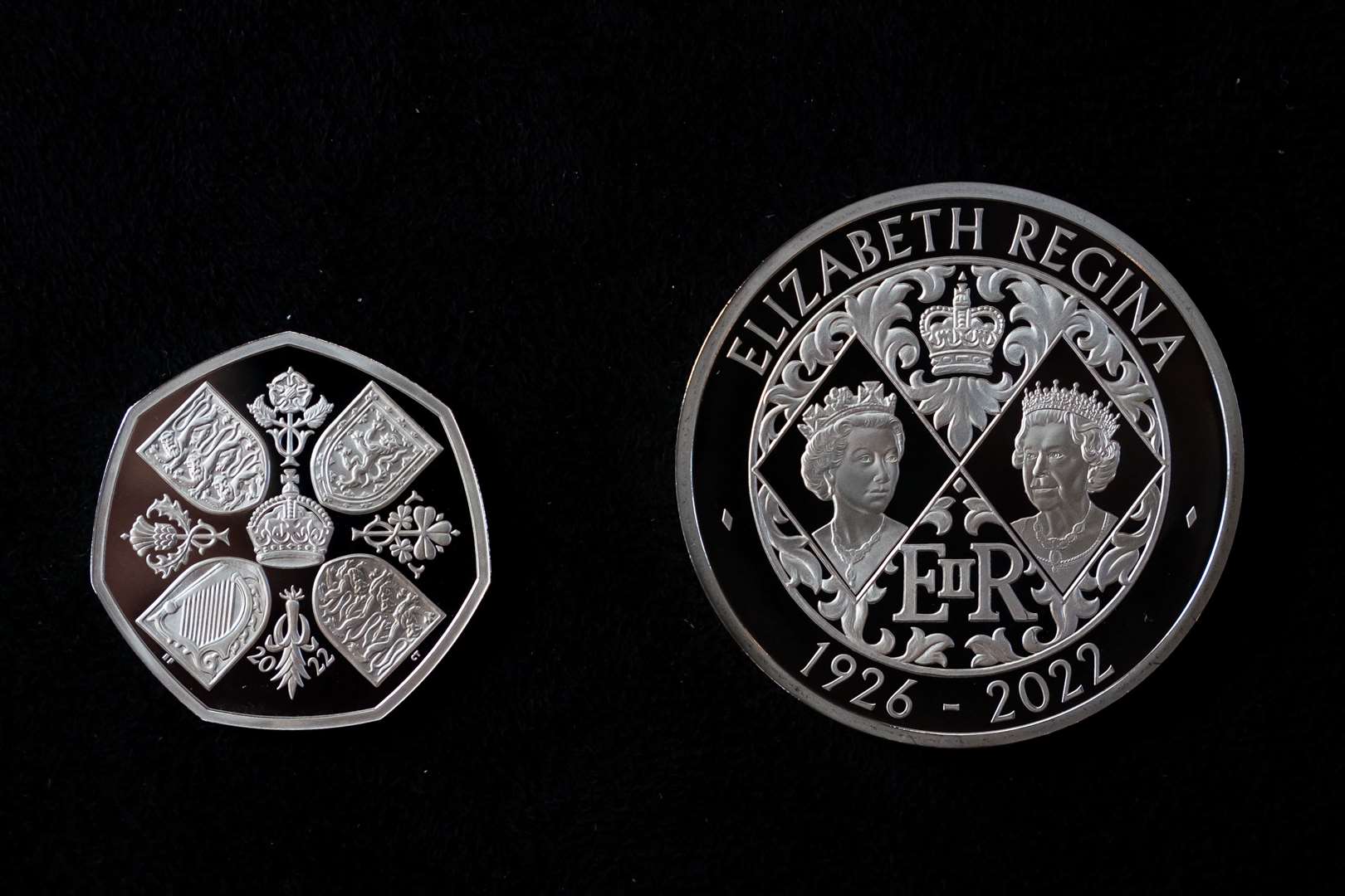 A 50 pence and £5 Crown commemorating the life and legacy of Queen Elizabeth II (Aaron Chown/PA)