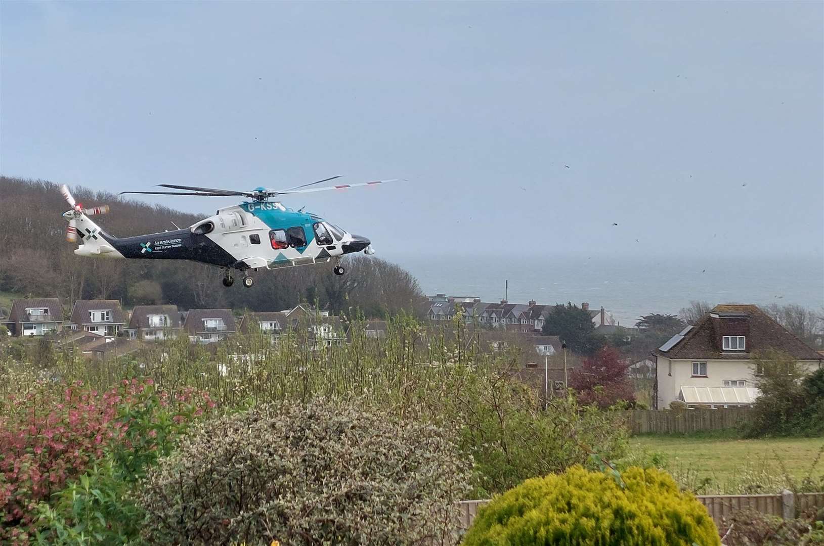 A cyclist has been taken to hospital by the air ambulance after falling off their bike while riding in woods near Shorncliffe Military Cemetery between Folkestone and Hythe. Picture: Frances Grellier