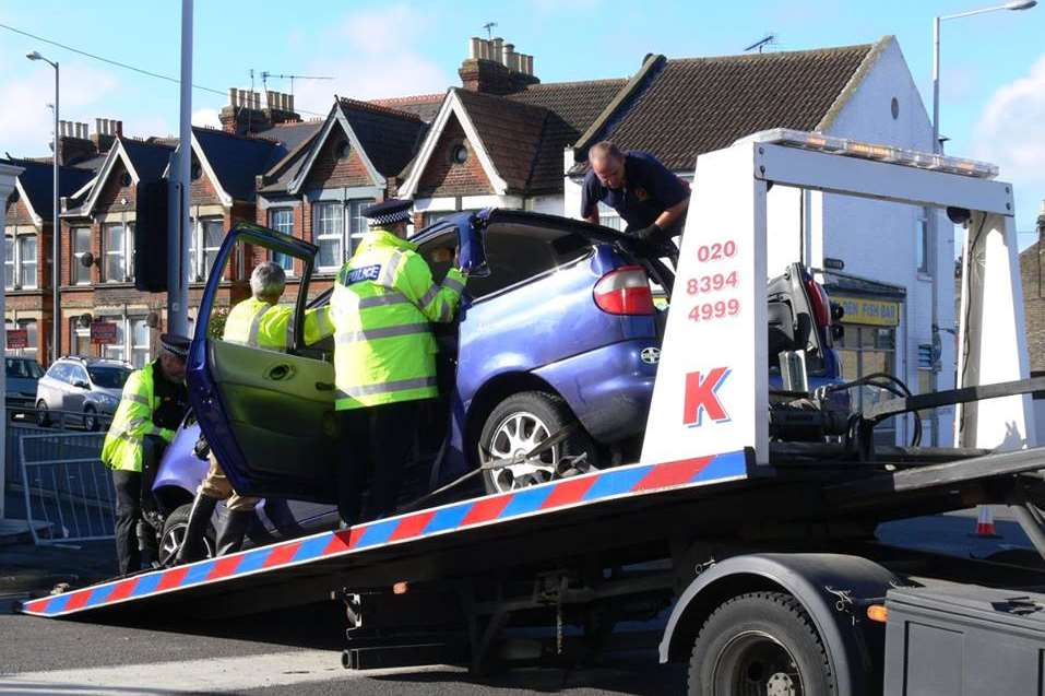 The blue Ford Galaxy is taken from the scene. Picture: Andrew Scott