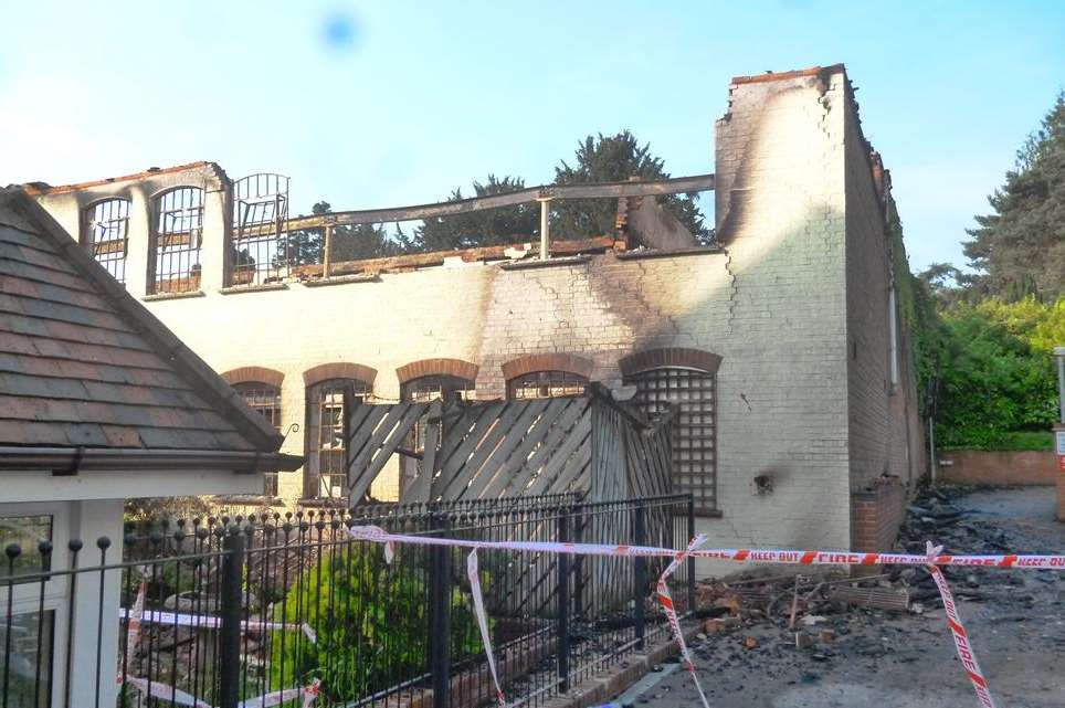 The remnants of the burnt building off Park Road Place
