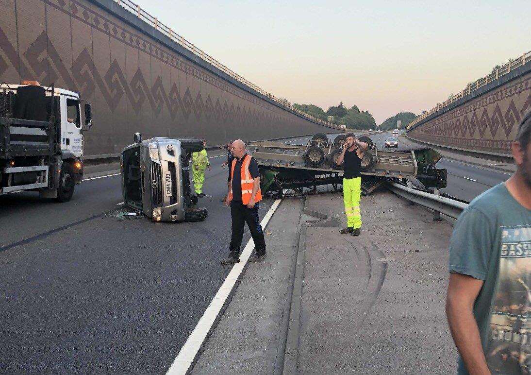 A truck and trailer overturned on the A249. Picture: @charlie_mcshane