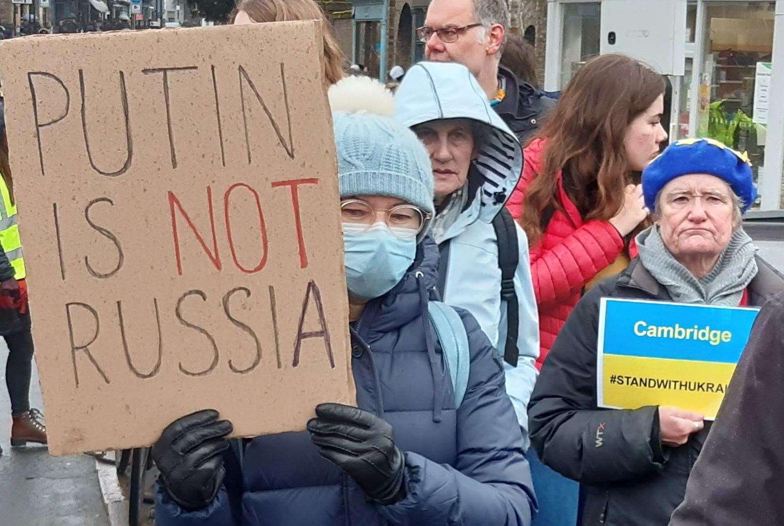 Protesters at a Stand With Ukraine march make it clear Russian premiere Vladimir Putin does not have the support of all citizens
