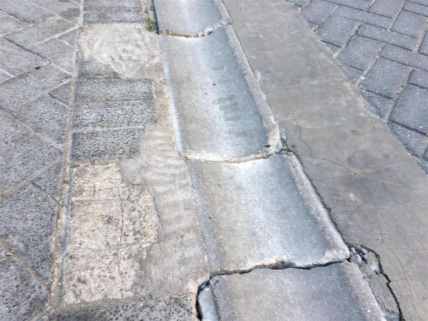 Broken paving in Highbury Lane