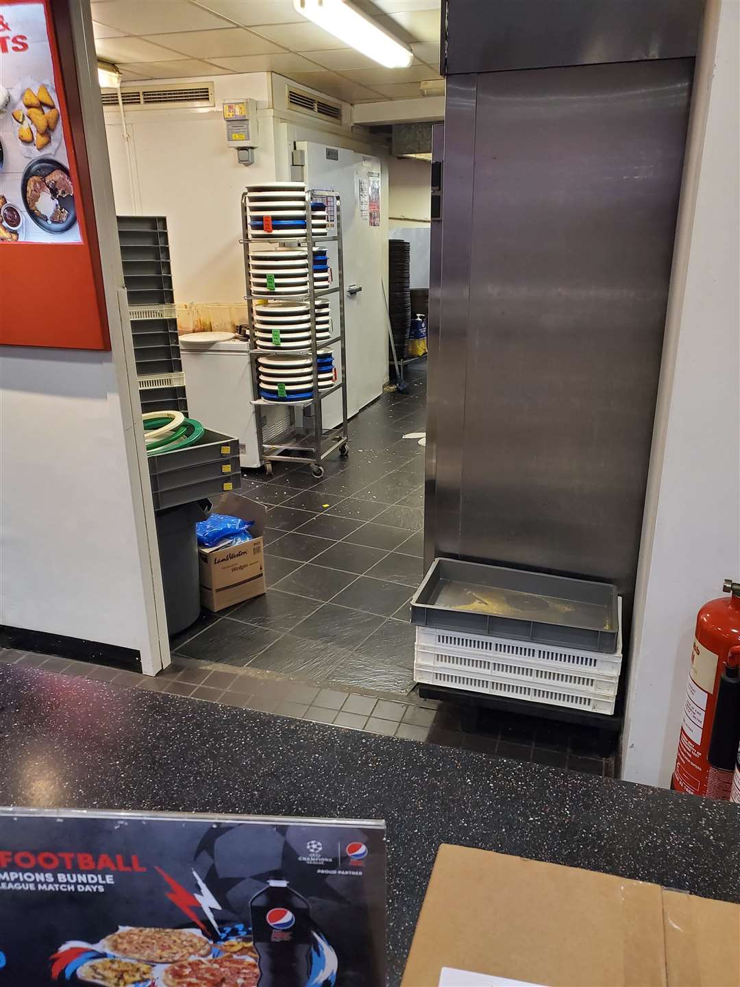 Staff at Pizza Hut in Perry Street preparing a pizza ontop of a fridge (31715316)
