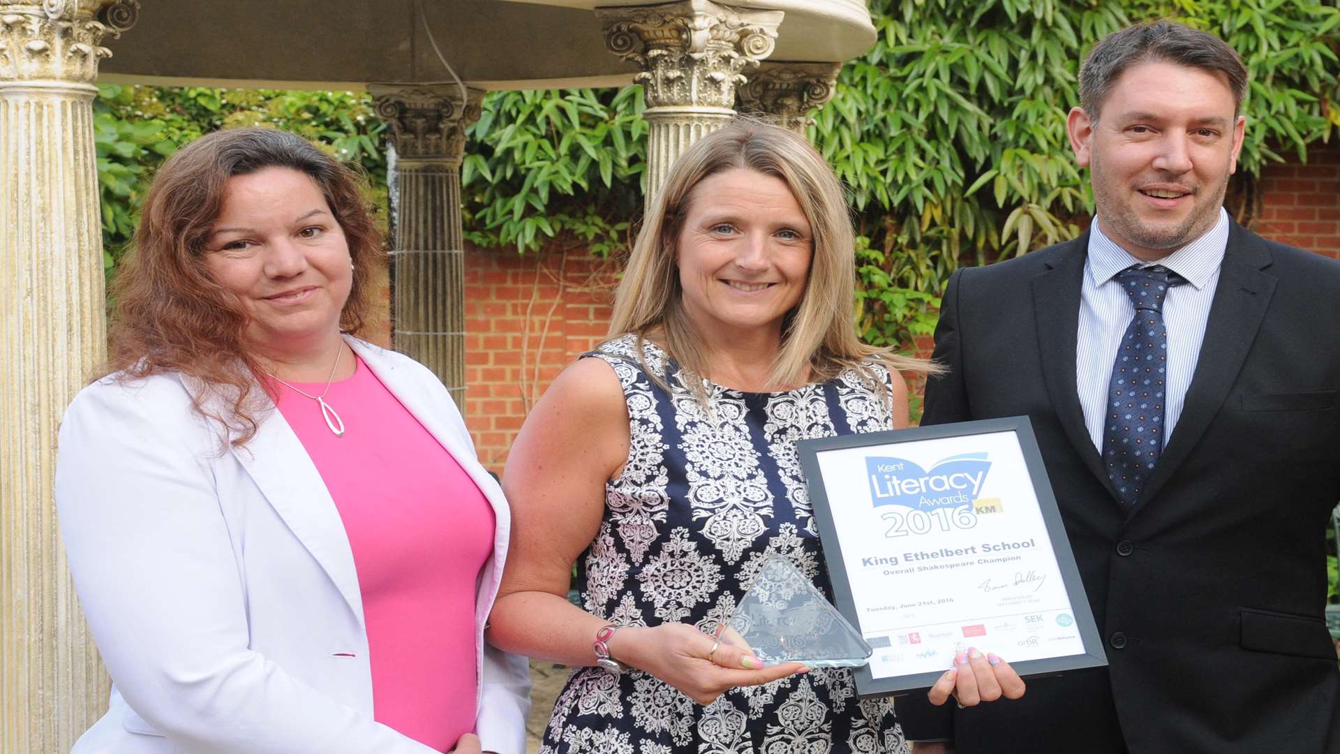 Sarah Wilson of King Ethelbert School, Thanet is presented with the Overall Shakespeare Champion Award by key partners Russell Smith of Orbit South and Claire Turner of School News Group