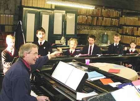 PRACTICE MAKES IT PERFECT: Choirmaster Dr David Flood leads the rehearsals